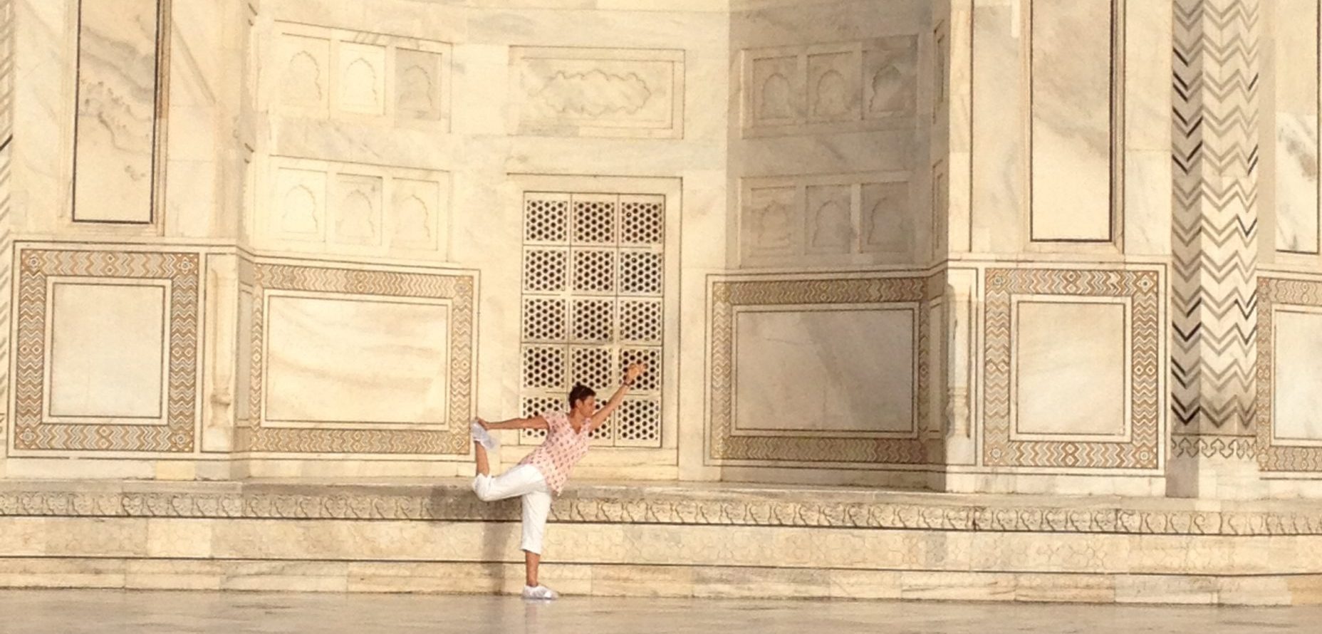 Martine Naranjasana Dancer pose at the Taj Mahal